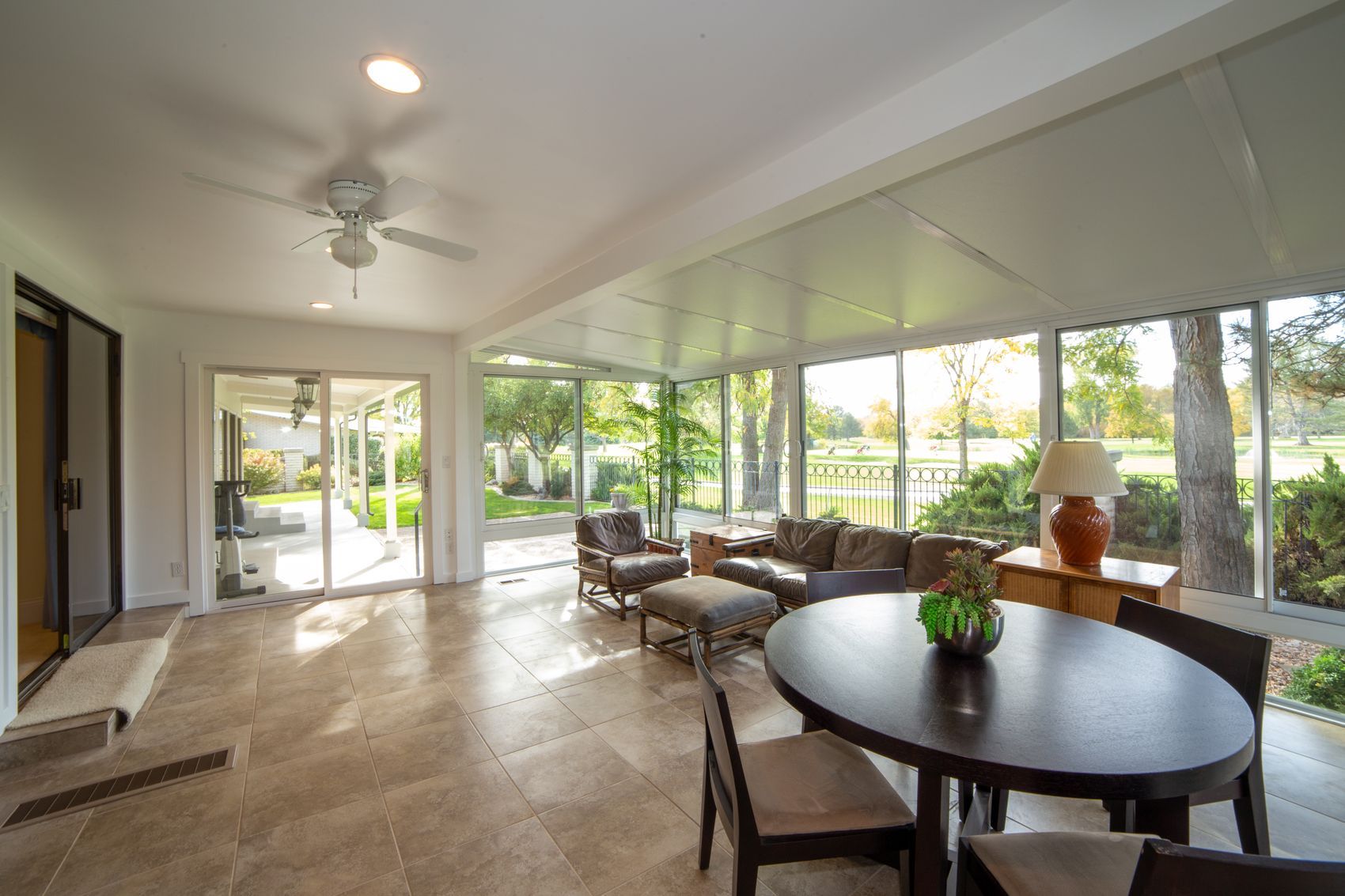 A bright garden room with glazed doors onto the lawn