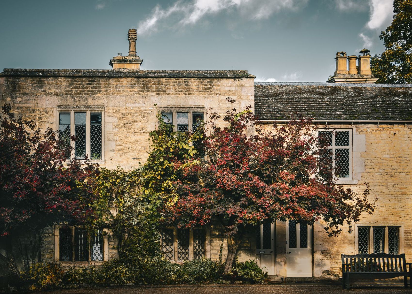 A Cotswold stone house with stone-mullioned windows