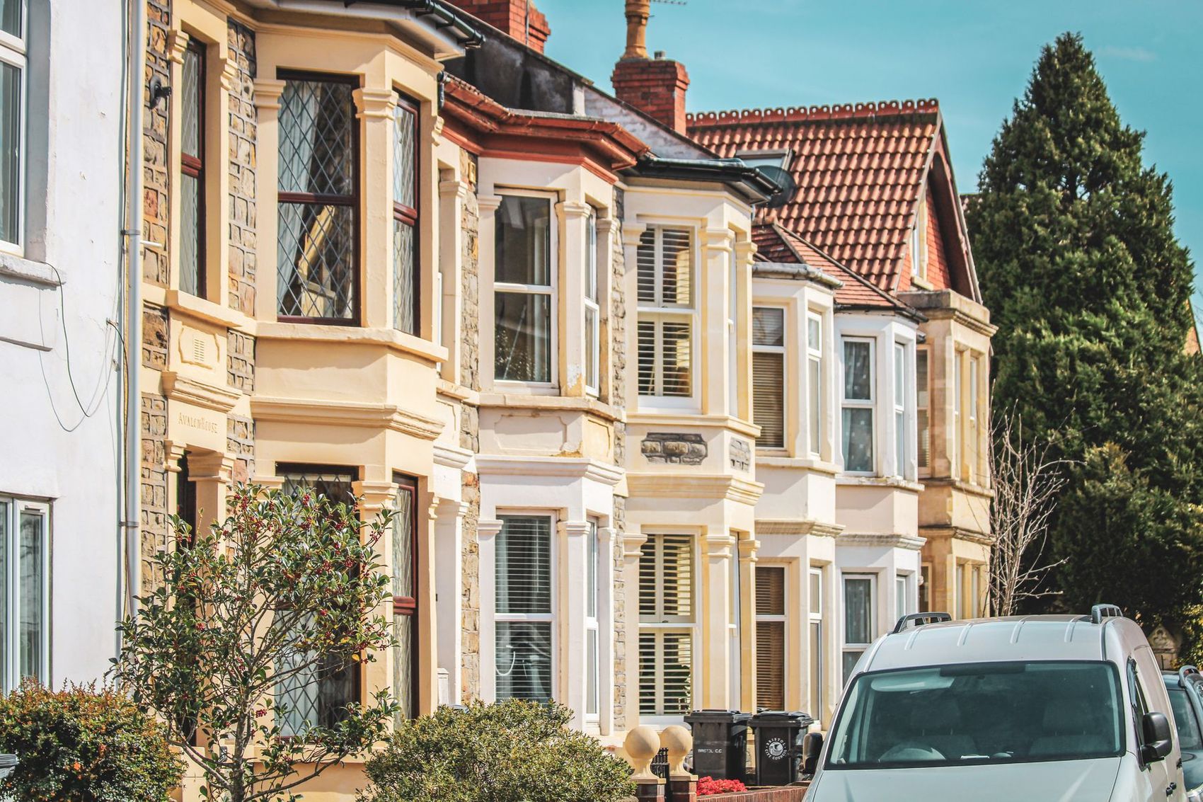 Pastel-painted bay-fronted terraces with white sash windows
